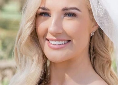 Bride with radiant smile at Mysa Beauty & Training, Godmanchester, England, GB.