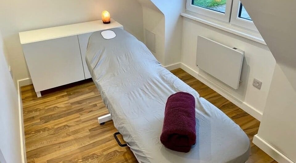 Therapy room with massage table at Elisa Carvajal Beauty, Aberdeen, Scotland, GB. Soft lighting for relaxation.