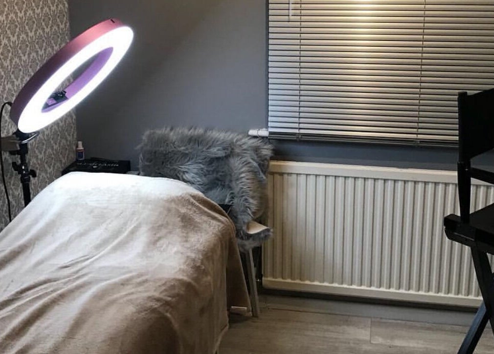 Chic beauty treatment room at By Sophie Louise, Colchester, England, GB with a stylish chair and ring light.