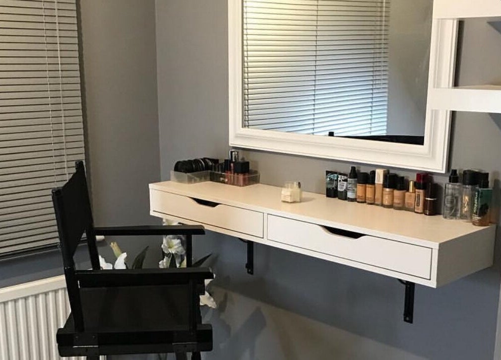Chic makeup station at By Sophie Louise in Colchester, England, GB, featuring a sleek mirror and elegant products.