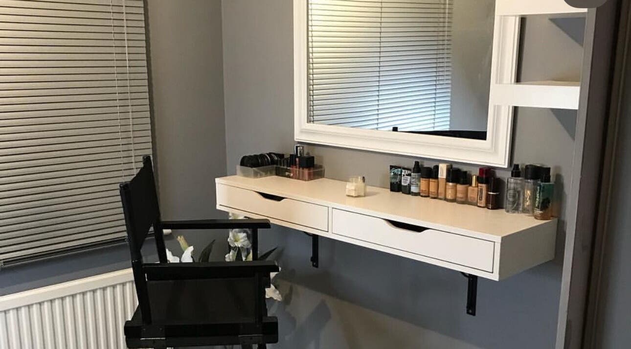 Chic makeup station at By Sophie Louise in Colchester, England, GB, featuring a sleek mirror and elegant products.