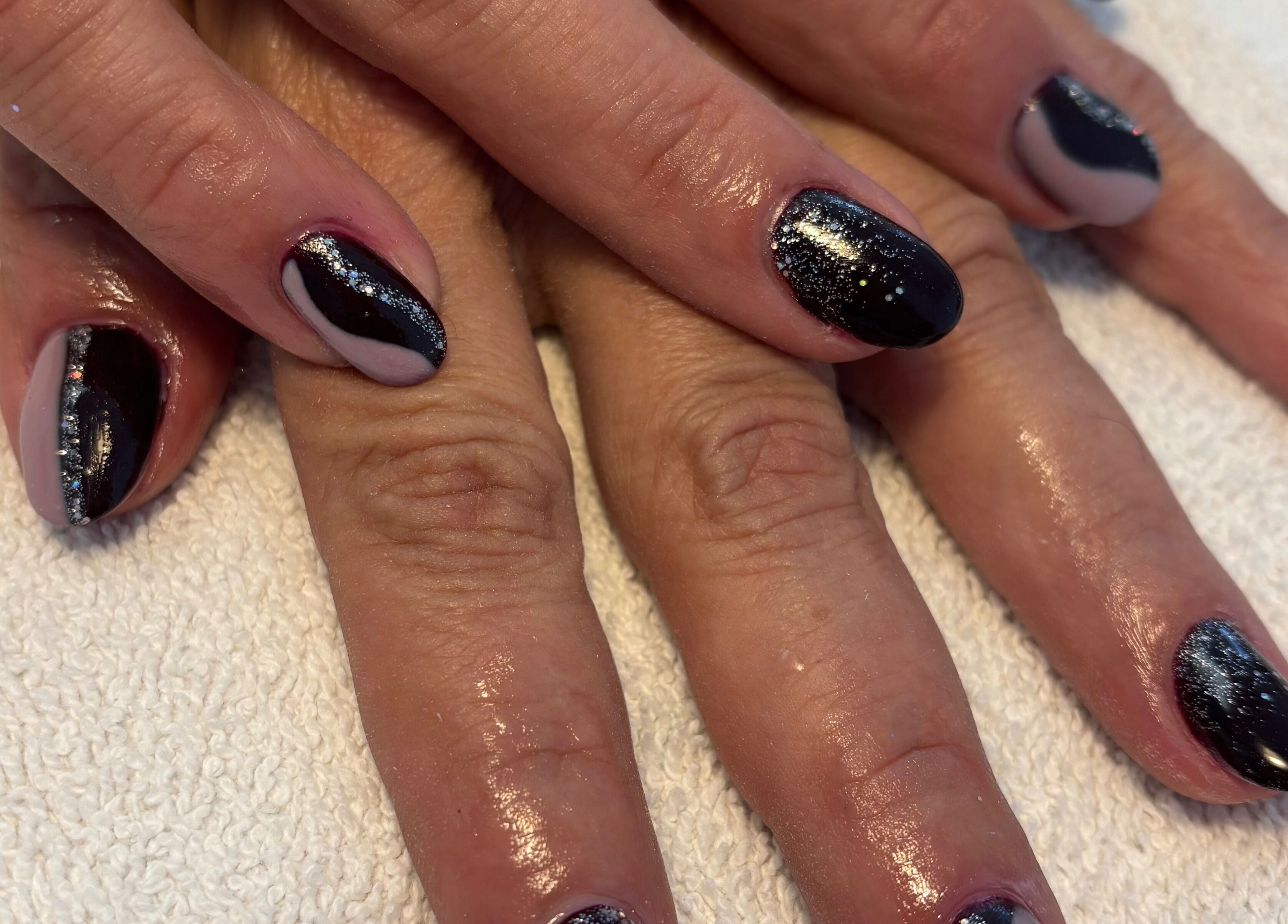 Stylish black nail art with glitter at Dolce Vita Spa, Hanover, Ontario, CA.