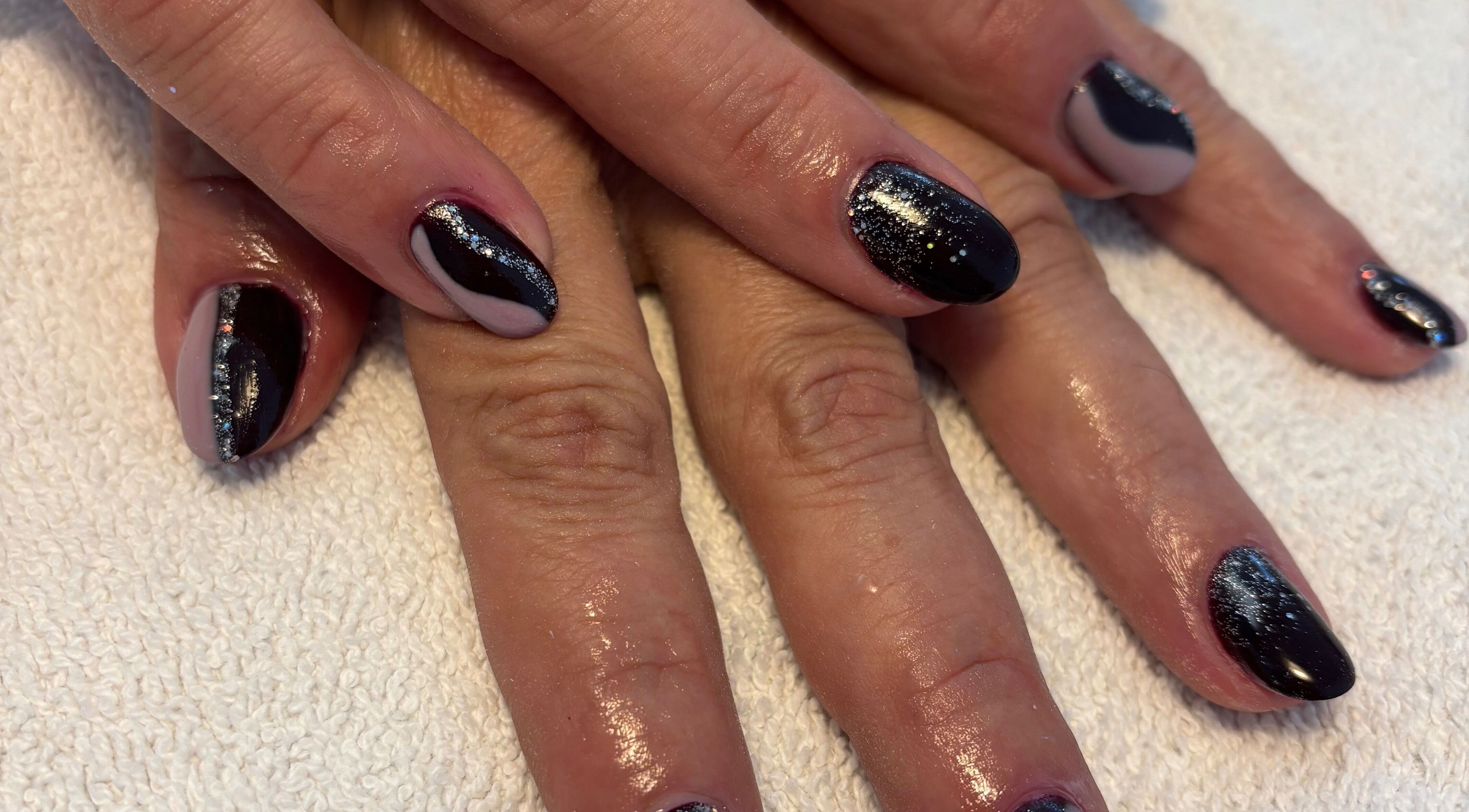 Stylish black nail art with glitter at Dolce Vita Spa, Hanover, Ontario, CA.