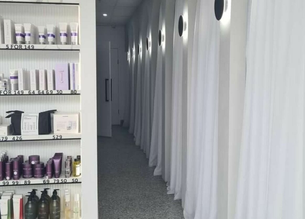 Product shelves and elegant hallway at Rejuvenate Laser & Skin Clinic, Pascoe Vale, VIC, AU.