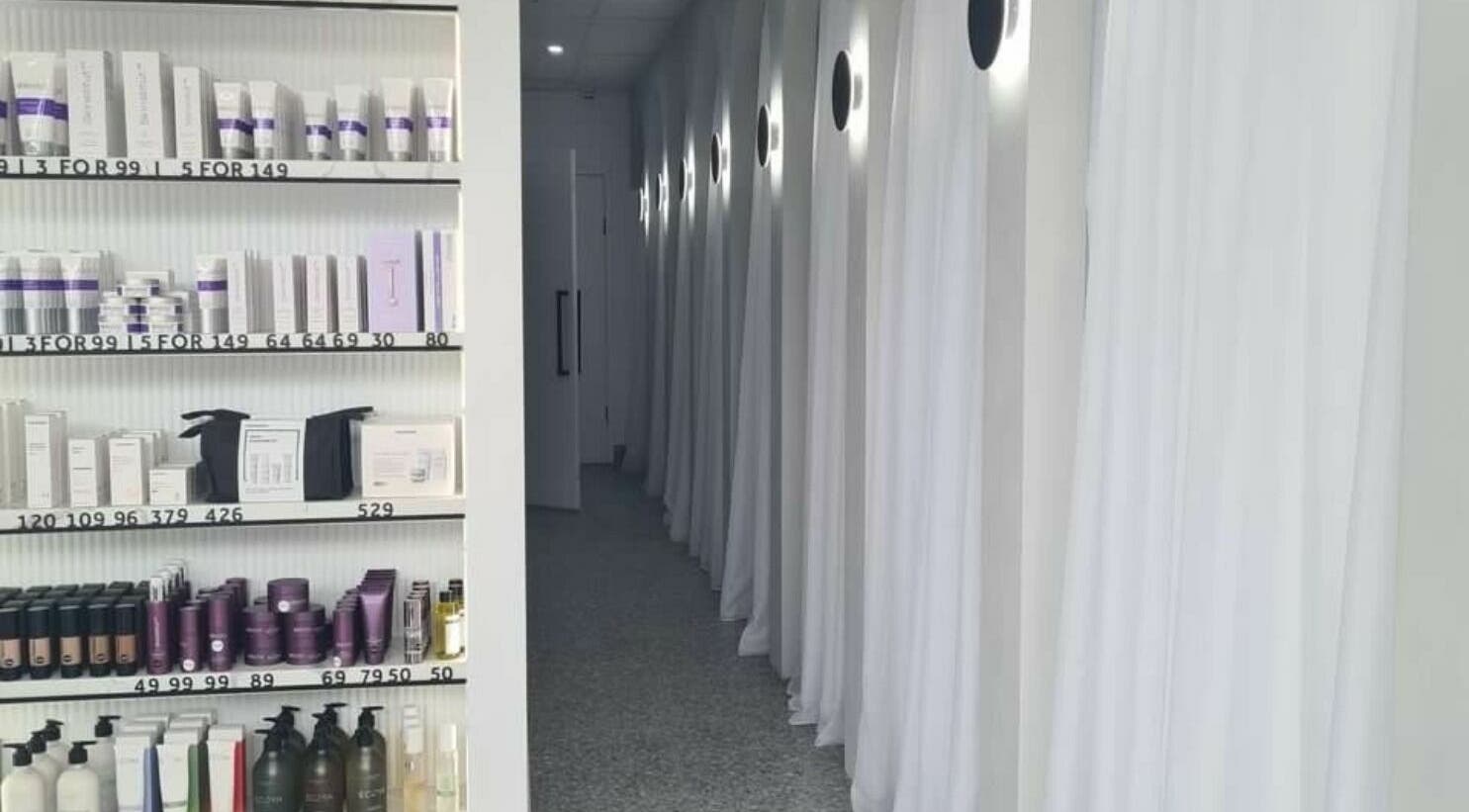 Product shelves and elegant hallway at Rejuvenate Laser & Skin Clinic, Pascoe Vale, VIC, AU.
