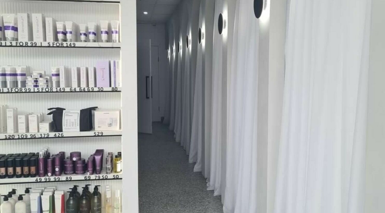 Product shelves and elegant hallway at Rejuvenate Laser & Skin Clinic, Pascoe Vale, VIC, AU.