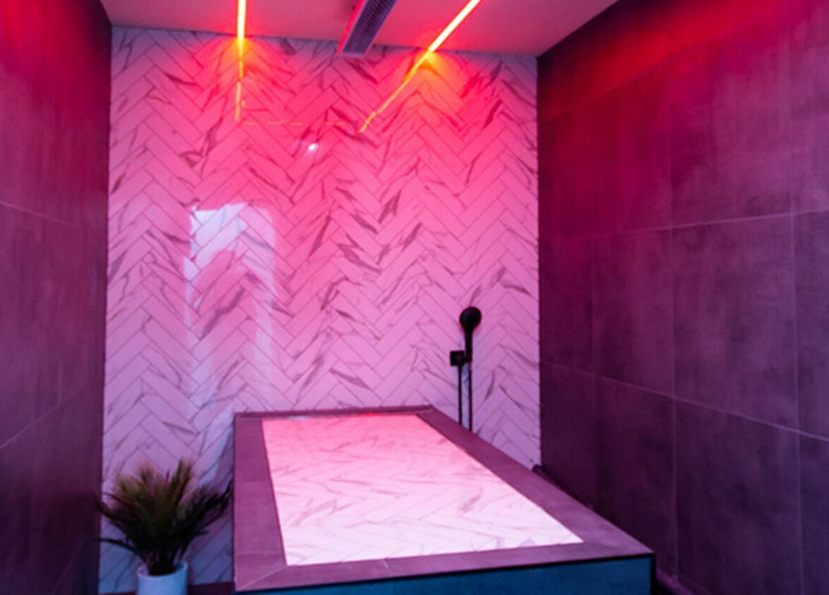 Relaxing spa room with pink lighting at Rejuvenate Laser & Skin Clinic, Pascoe Vale, VIC, AU.