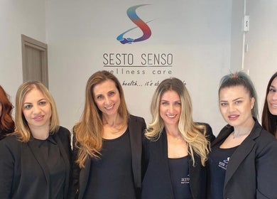 Sesto Senso Wellness Care team members smiling at Limassol, Limassol, CY entrance.