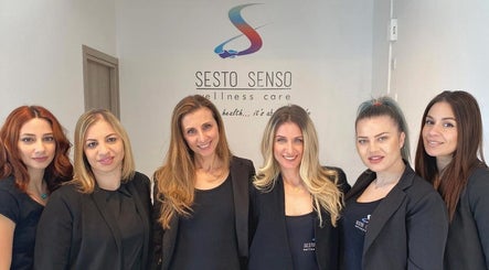 Sesto Senso Wellness Care team members smiling at Limassol, Limassol, CY entrance.