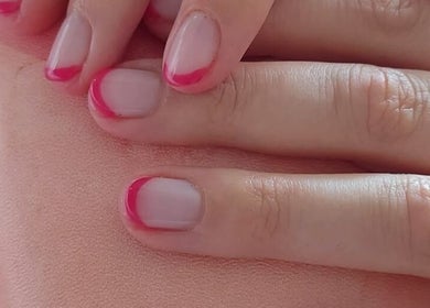 Close-up of stylish pink french manicure by B Yo Uty Hair and Beauty Mobile Service in London, England, GB.