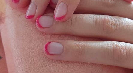 Close-up of stylish pink french manicure by B Yo Uty Hair and Beauty Mobile Service in London, England, GB.