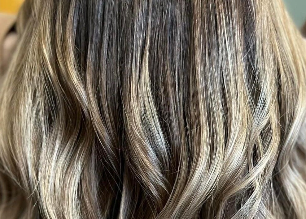 Lustrous balayage highlights at Studio 815, Genoa, Illinois, US, showcasing expert hair styling.