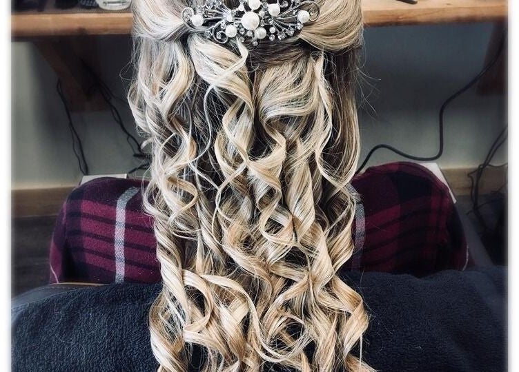 Intricate hair styling with curls and jewel pin at Studio 815, Genoa, Illinois, US.