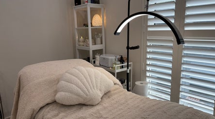 Relaxing treatment room at Saoirse Skin and Beauty, Melbourne, Victoria, AU with plush bed and gentle lighting.