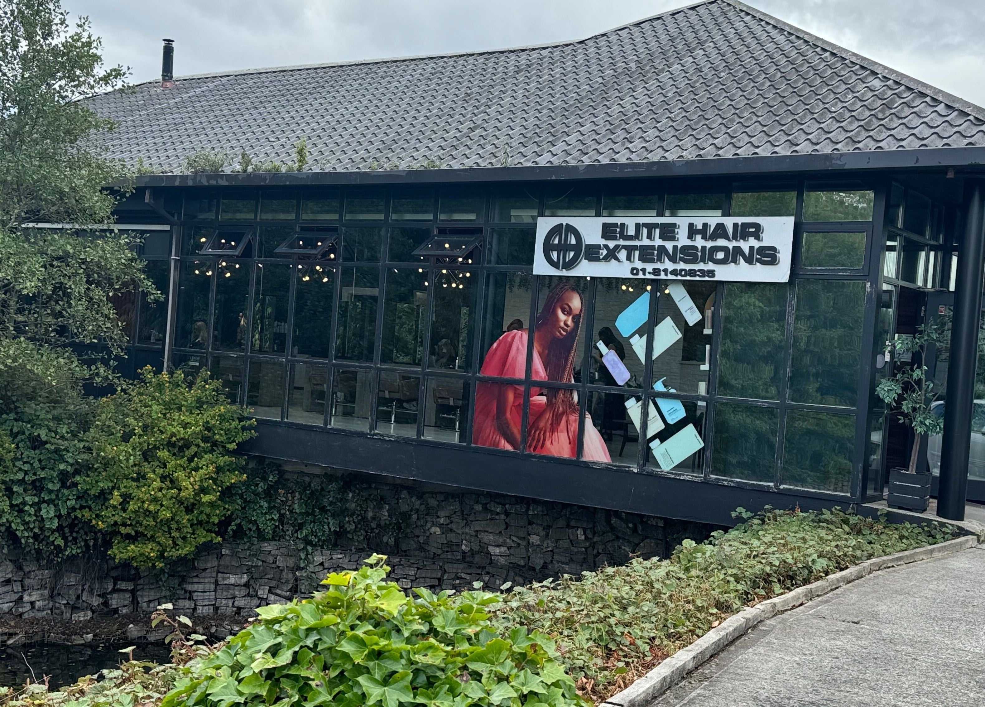 Elite Hair Extensions in Dublin, County Dublin, IE with modern glass facade and greenery.