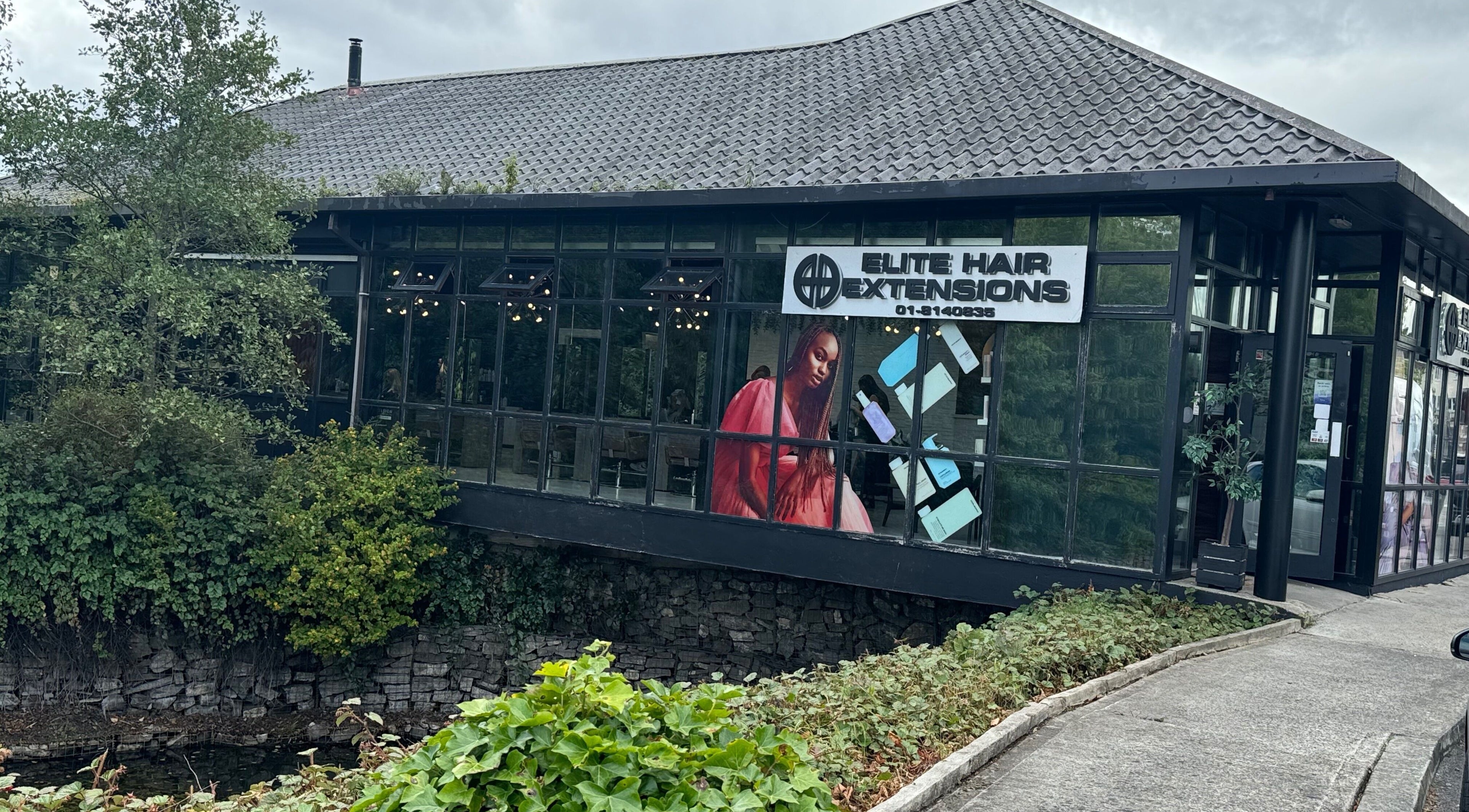 Elite Hair Extensions in Dublin, County Dublin, IE with modern glass facade and greenery.