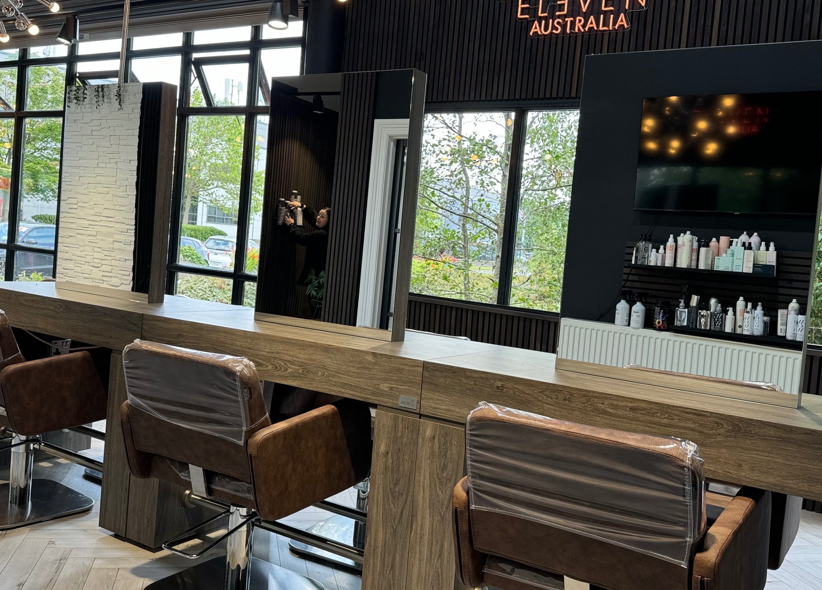 Elegant salon interior at Elite Hair Extensions in Dublin, County Dublin, IE featuring modern styling stations.