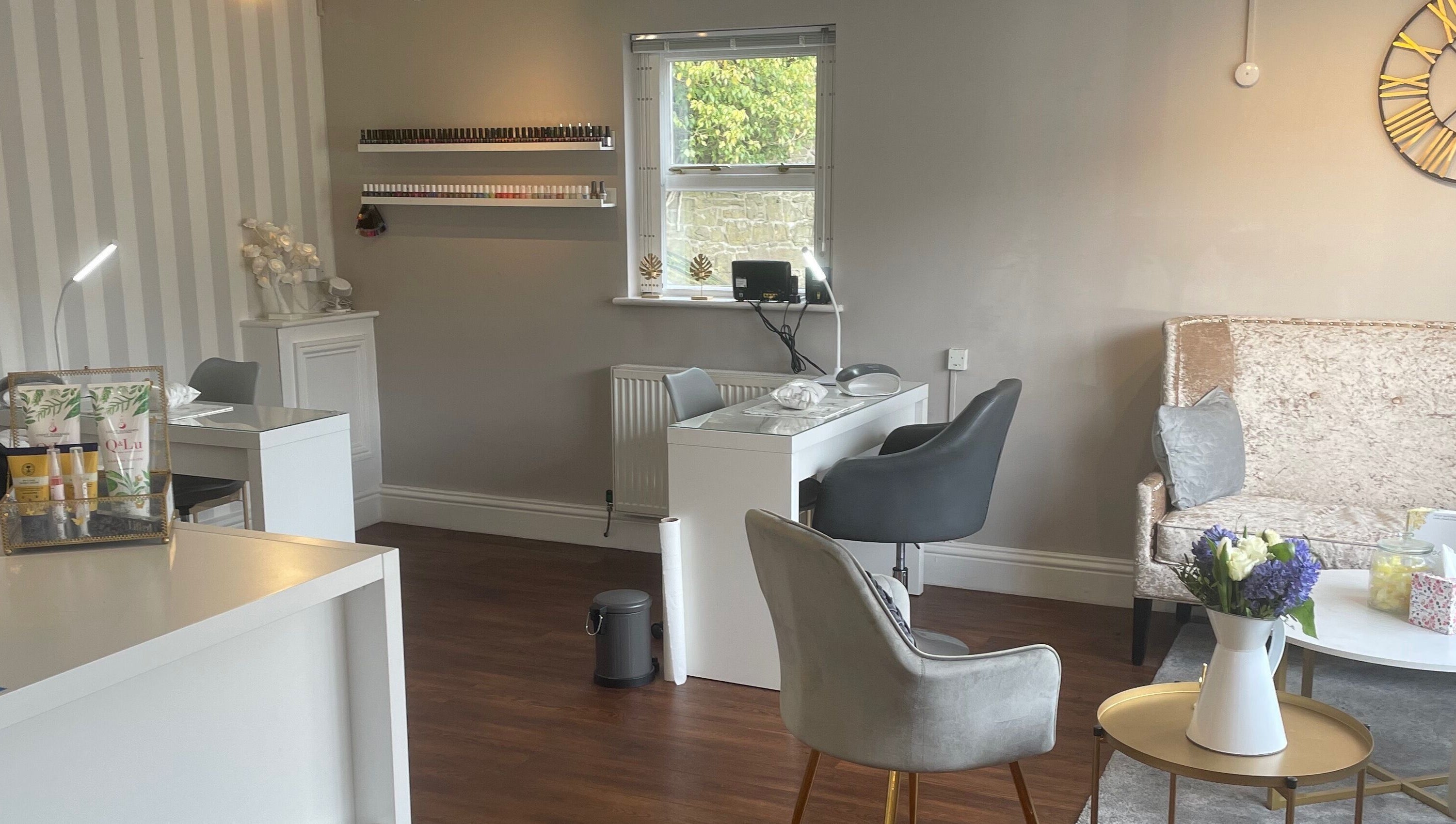 Chic interior of Soothe Day Spa in Whaley Bridge, England, featuring plush seating and serene decor.