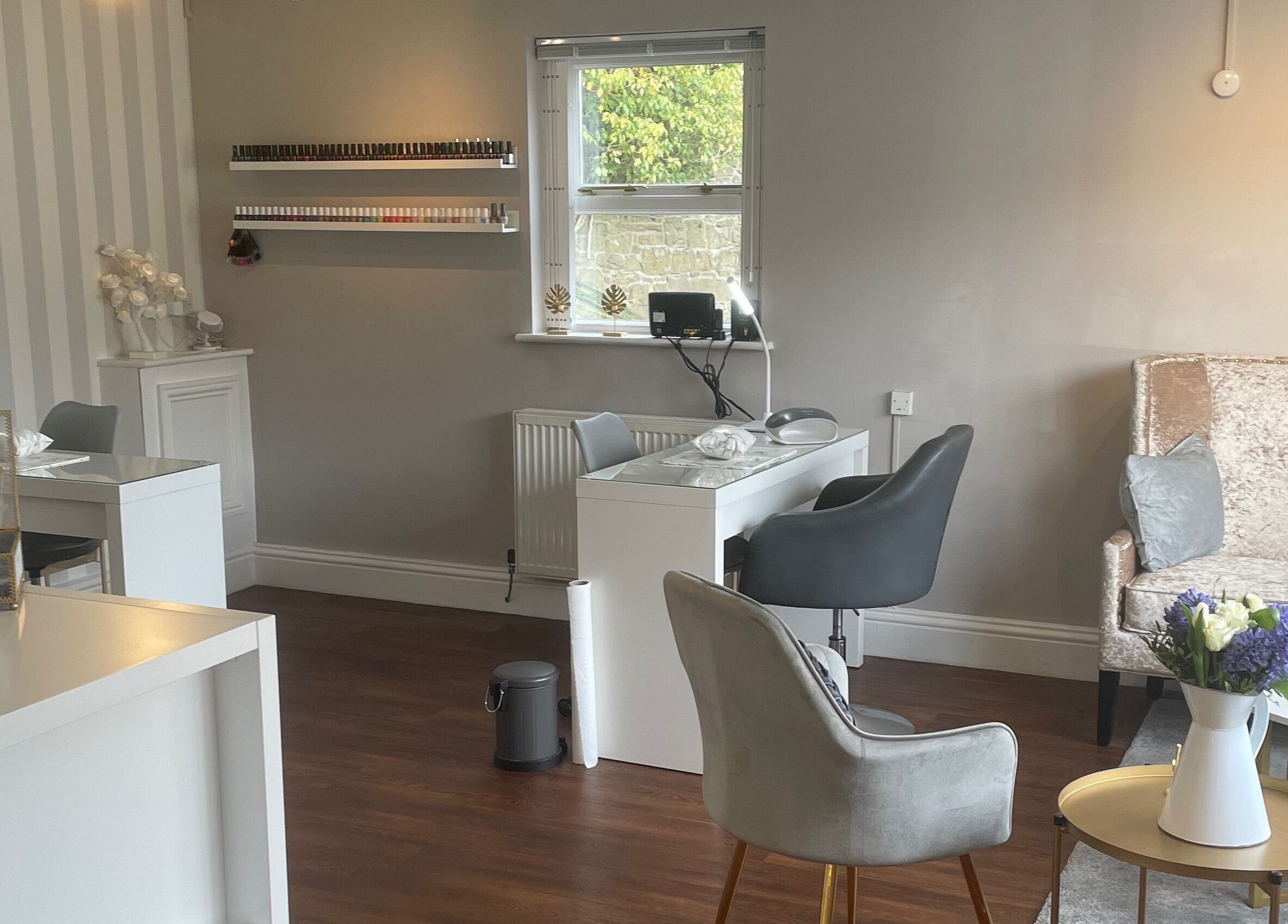 Chic interior of Soothe Day Spa in Whaley Bridge, England, featuring plush seating and serene decor.