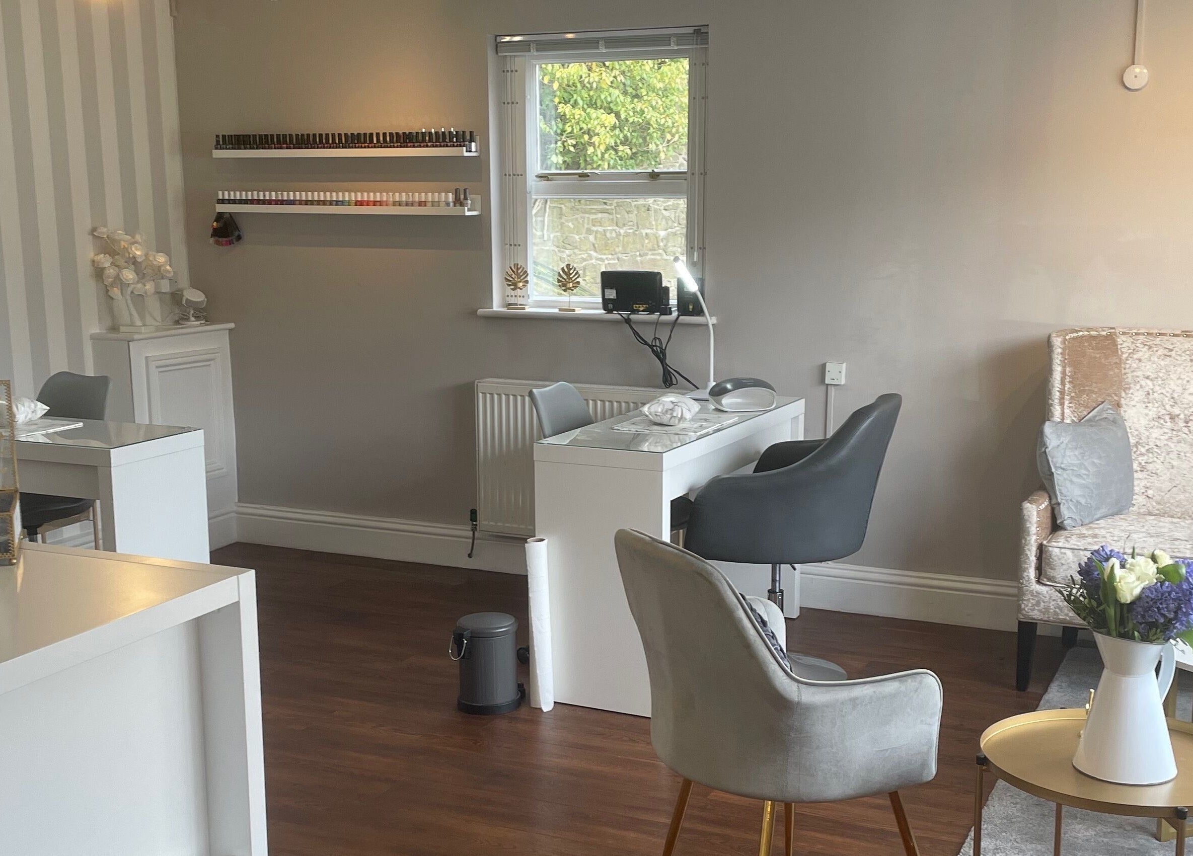 Chic interior of Soothe Day Spa in Whaley Bridge, England, featuring plush seating and serene decor.