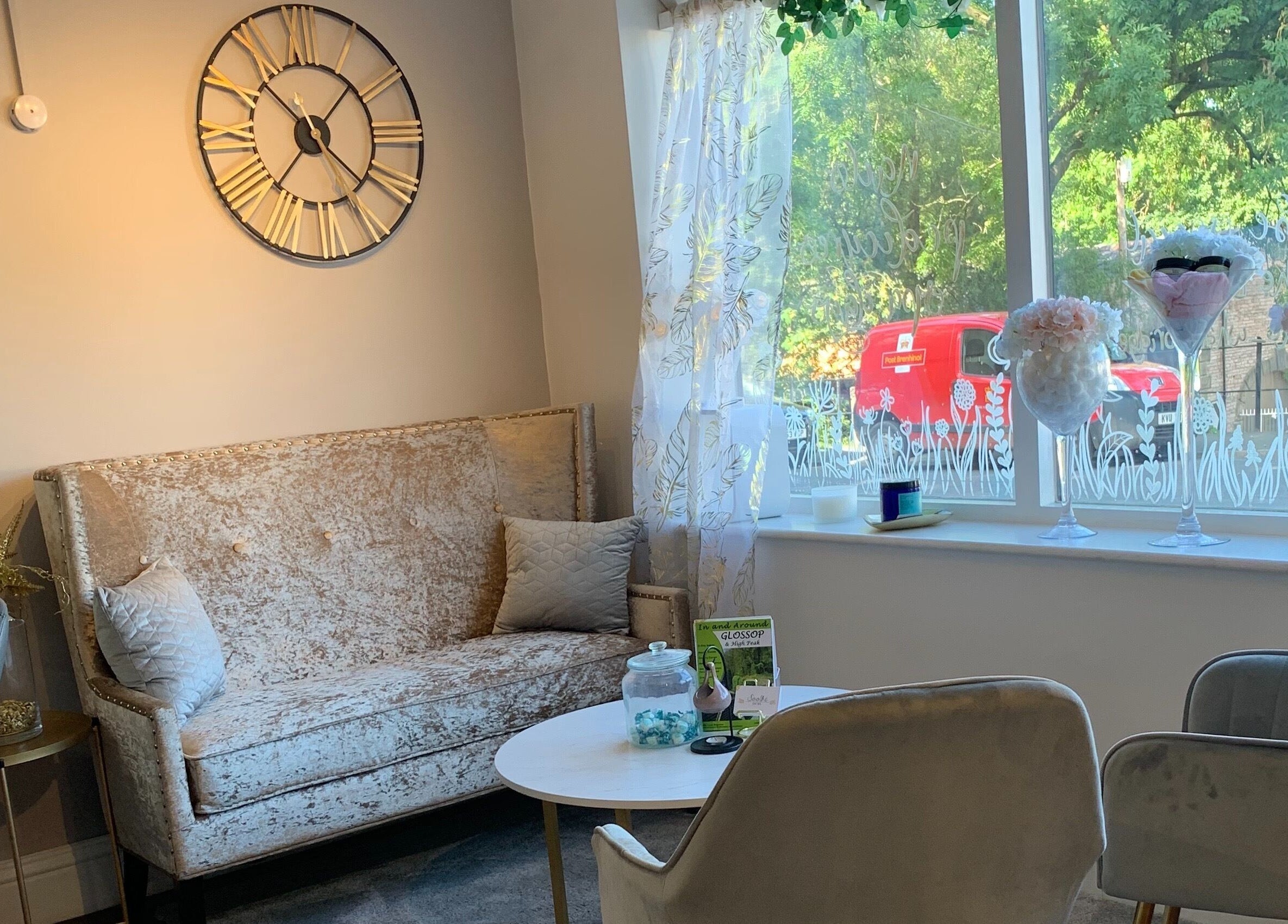 Sophisticated waiting area at Soothe Day Spa, Whaley Bridge, England, GB with plush seating by a bright window.
