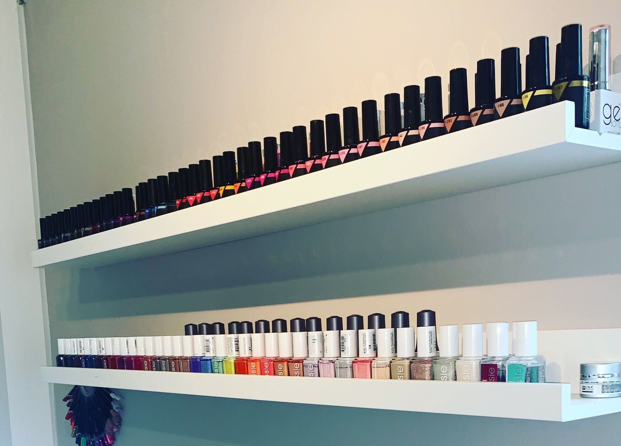 Vibrant nail polish display at Soothe Day Spa, Whaley Bridge, England, GB for professional manicures.