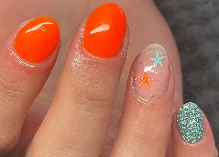 Bright and glittery nail art with starfish design at Soothe Day Spa, Whaley Bridge, England, GB.