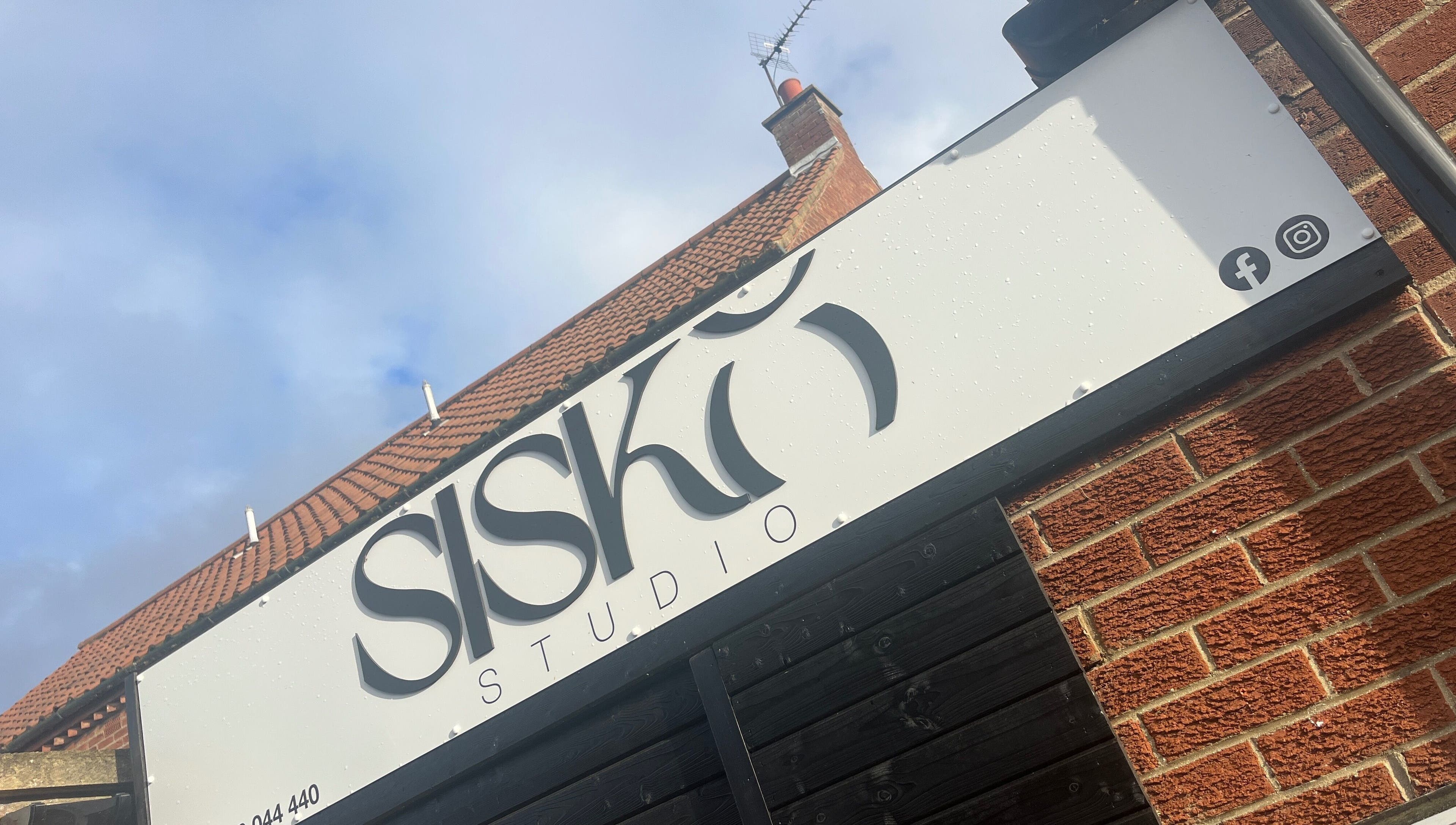 Signage on brick building exterior at Beverley - Kinda Pretty, Beverley, England, GB.