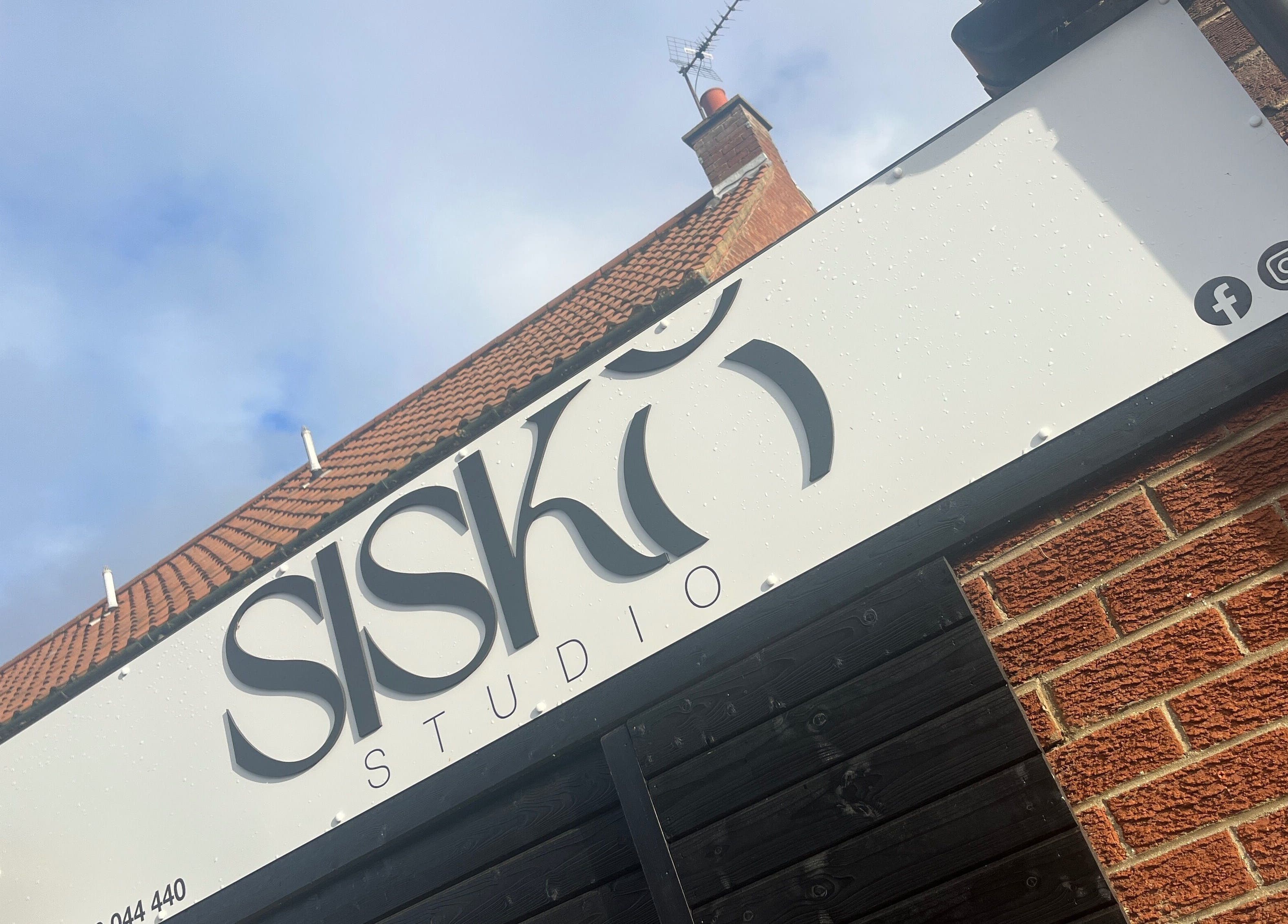 Signage on brick building exterior at Beverley - Kinda Pretty, Beverley, England, GB.