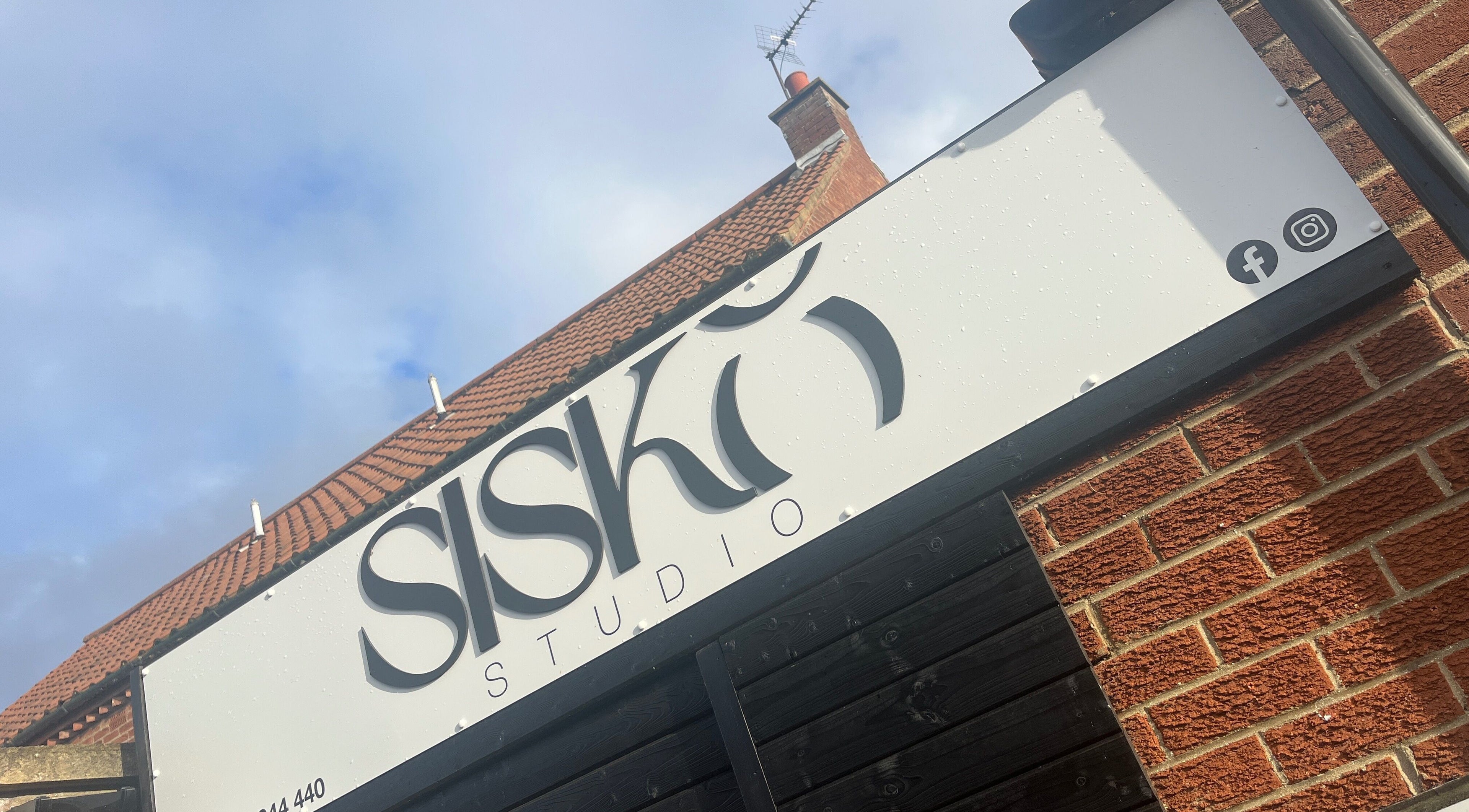 Signage on brick building exterior at Beverley - Kinda Pretty, Beverley, England, GB.