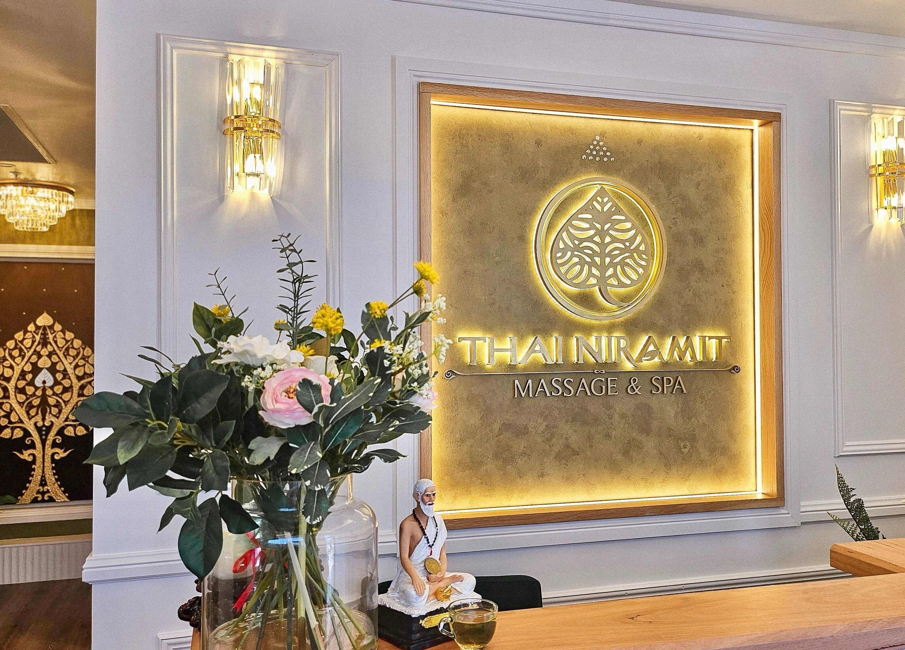 Elegant lit signage at Vaughan St. Branch - Thai Niramit Massage and Spa in Lidcombe, NSW, AU with flowers and decor.