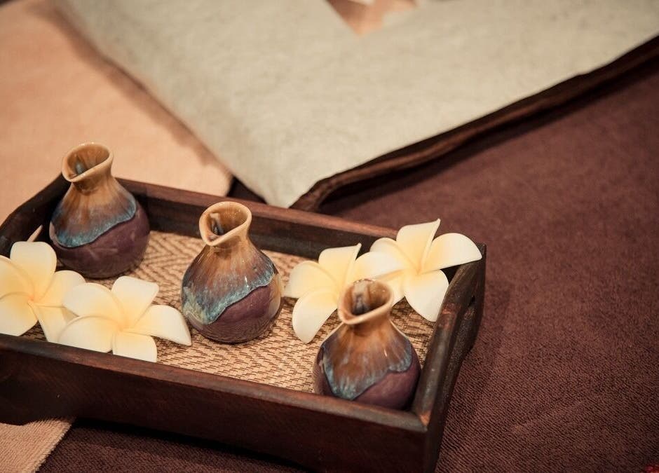 Elegant tray with oils and flowers at Vaughan St. Branch - Thai Niramit Massage and Spa, Lidcombe, NSW, AU.