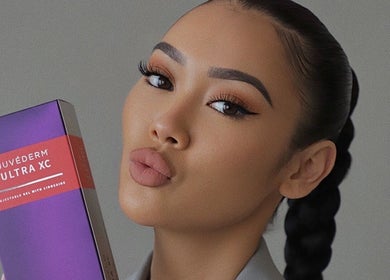 Woman showcasing Juvederm product at Derma Noor Medical Spa, Garden Grove, California, US
