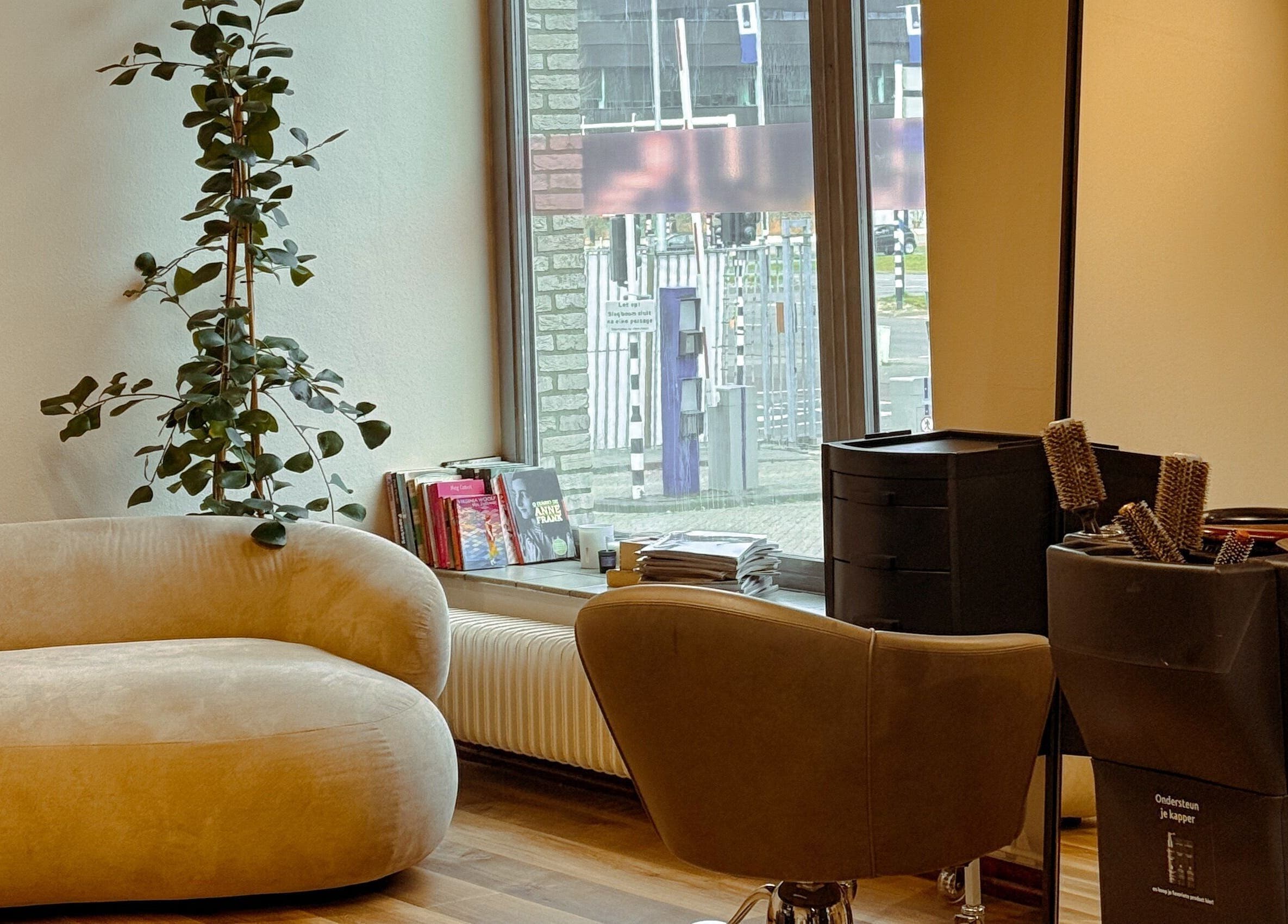 Elegant salon seating and styling area at Eliana Martt, Eindhoven, Noord-brabant, NL.