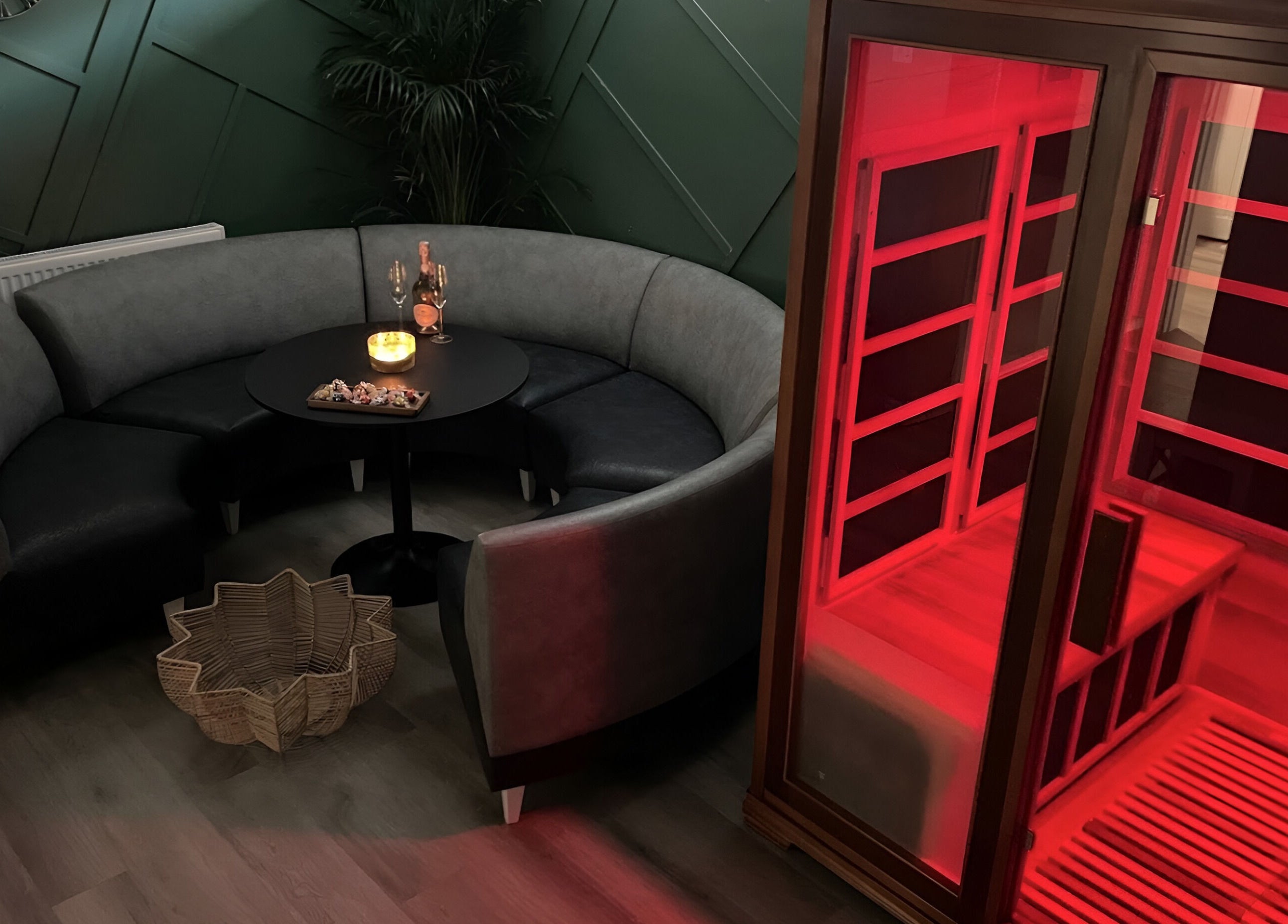 Cozy seating and sauna at Black Swan Therapy & Spa Lounge in Bognor Regis, England, GB. Warm ambiance with dim lighting.