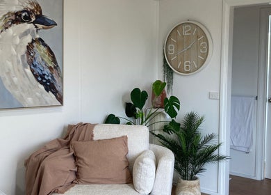 Cozy lounge at Altruistic Alternative Therapies, Muckatah, Victoria, AU with plants and art decor.