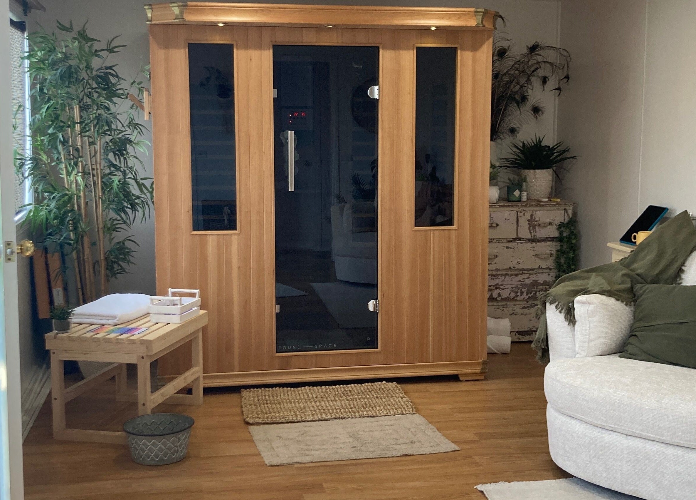 Cozy sauna room at Altruistic Alternative Therapies, Muckatah, Victoria, AU with plush seating and calming plants.