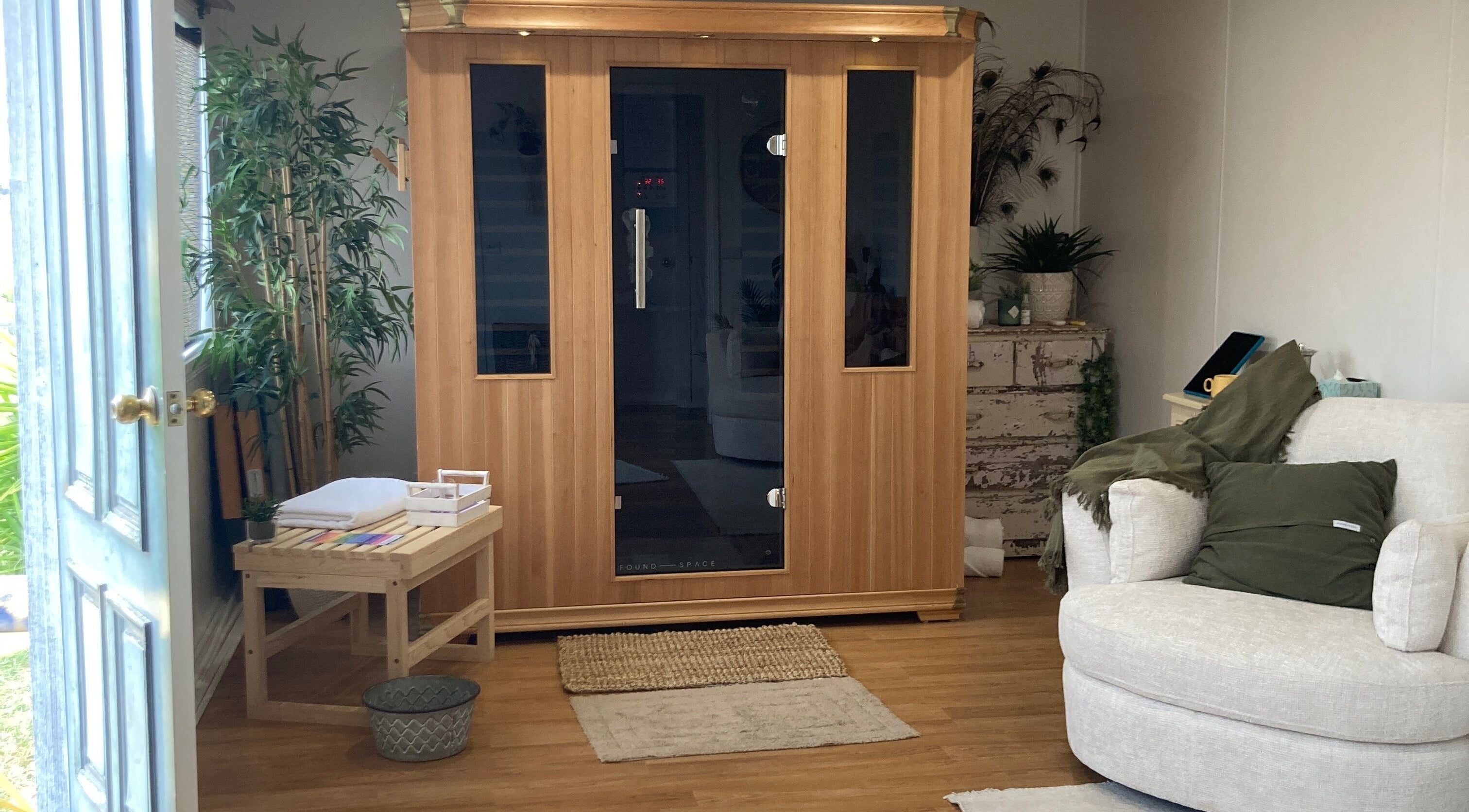 Cozy sauna room at Altruistic Alternative Therapies, Muckatah, Victoria, AU with plush seating and calming plants.