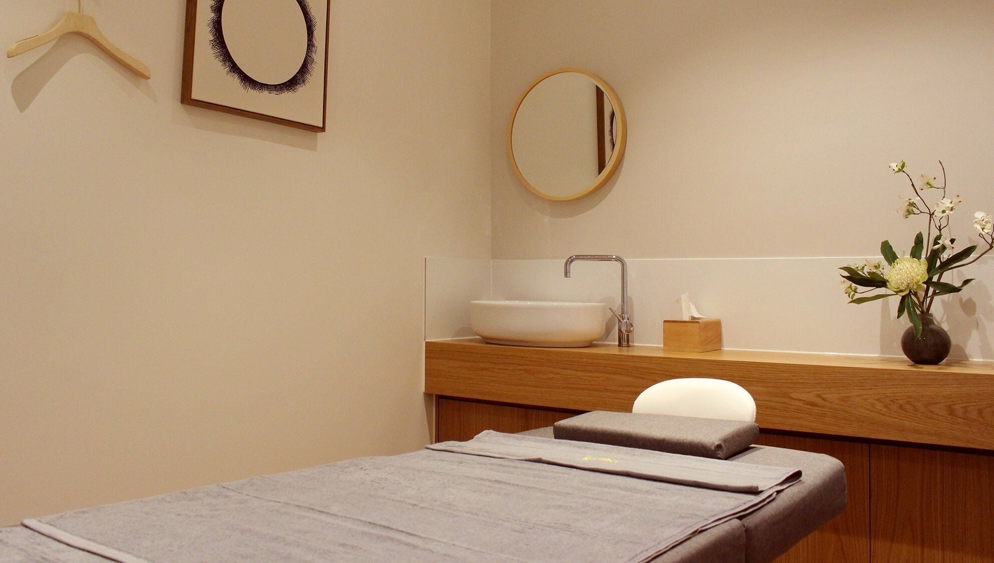 Relaxing treatment room at Five Elements Spa, South Melbourne, Victoria, AU, featuring elegant decor and tranquil ambiance.