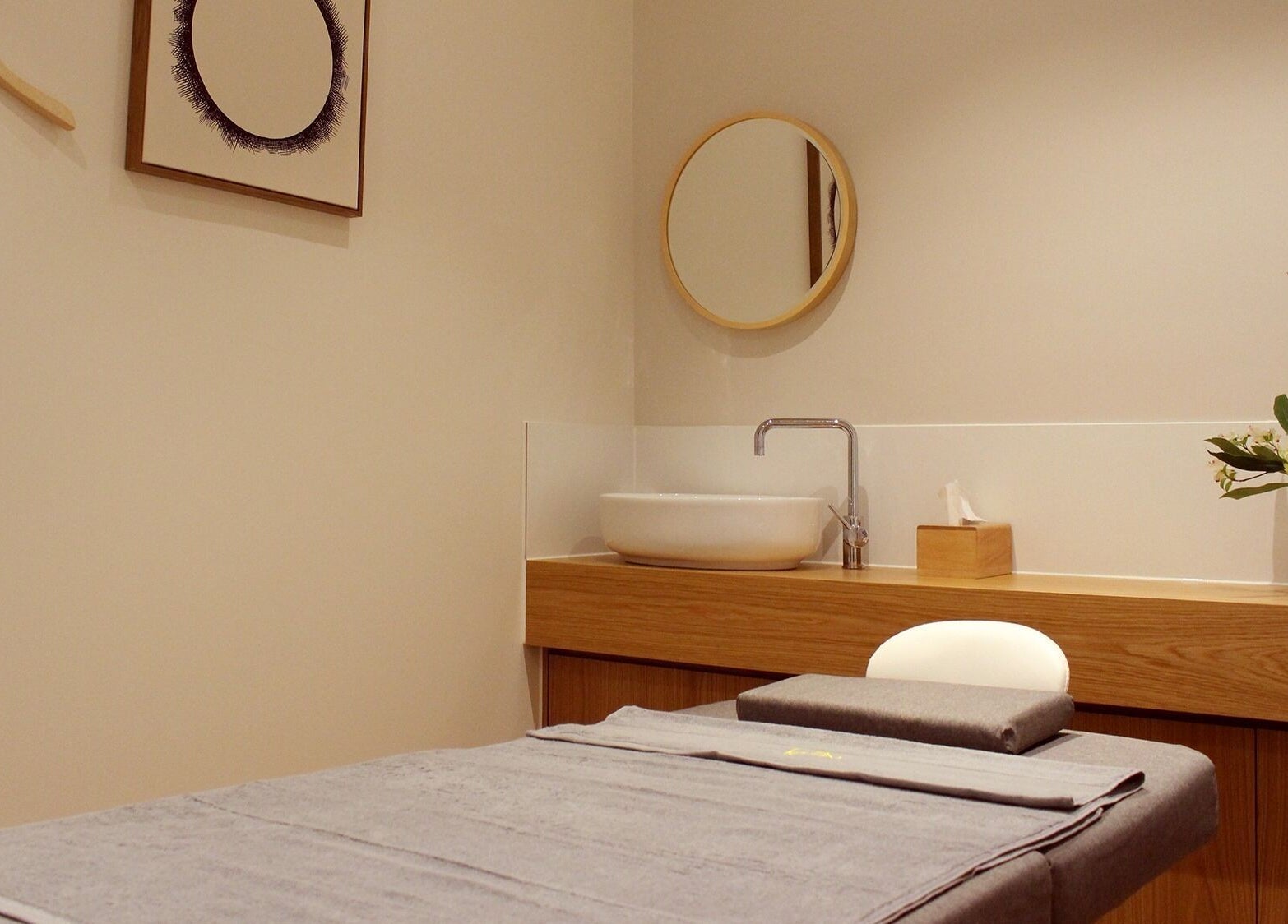 Relaxing treatment room at Five Elements Spa, South Melbourne, Victoria, AU, featuring elegant decor and tranquil ambiance.