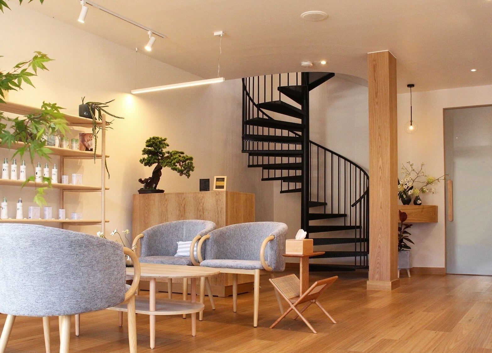 Stylish spa lobby at Five Elements Spa, South Melbourne, Victoria, AU with elegant decor and spiral staircase.