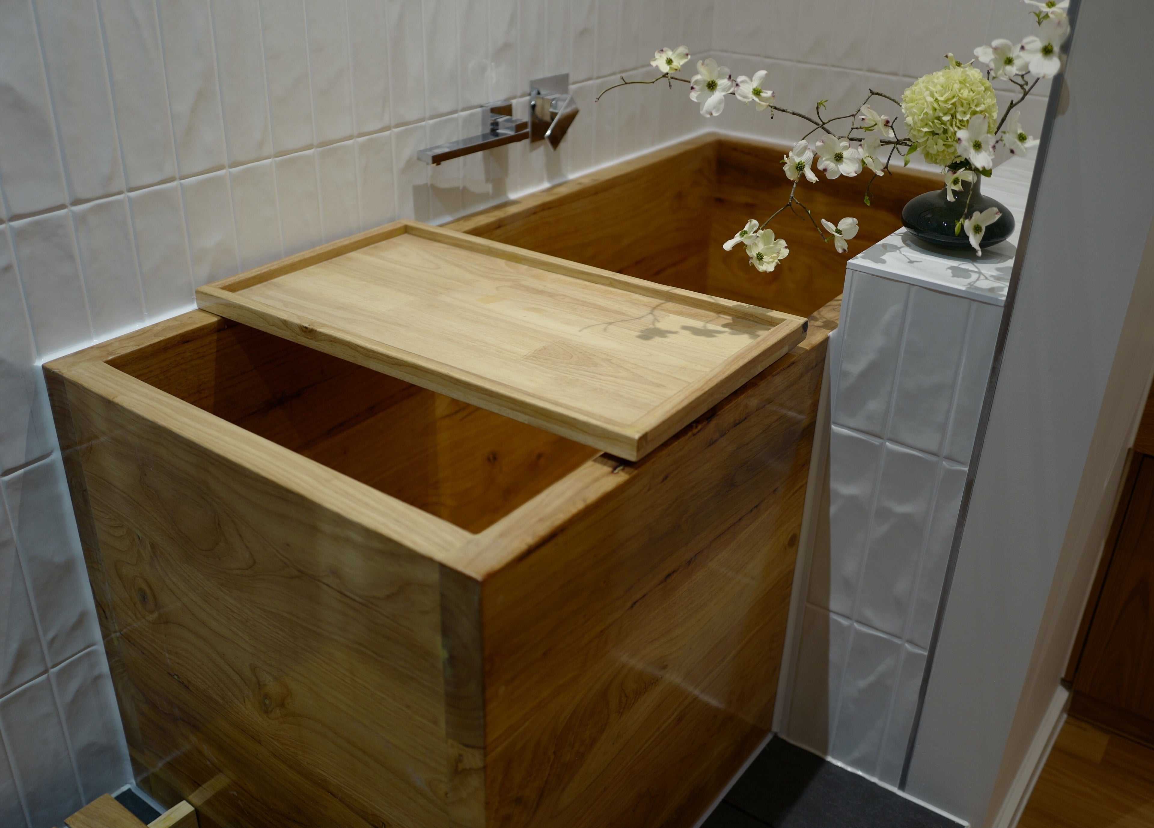 Elegant wooden bath at Five Elements Spa, South Melbourne, Victoria, AU with serene floral decor.