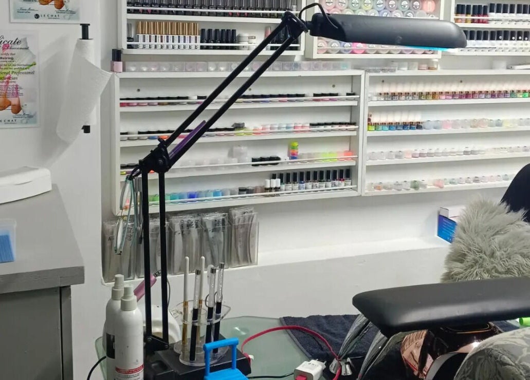 Nail studio at Dare 2B Beautiful, Boksburg, Gauteng, ZA, showcasing organized polishes and equipment.