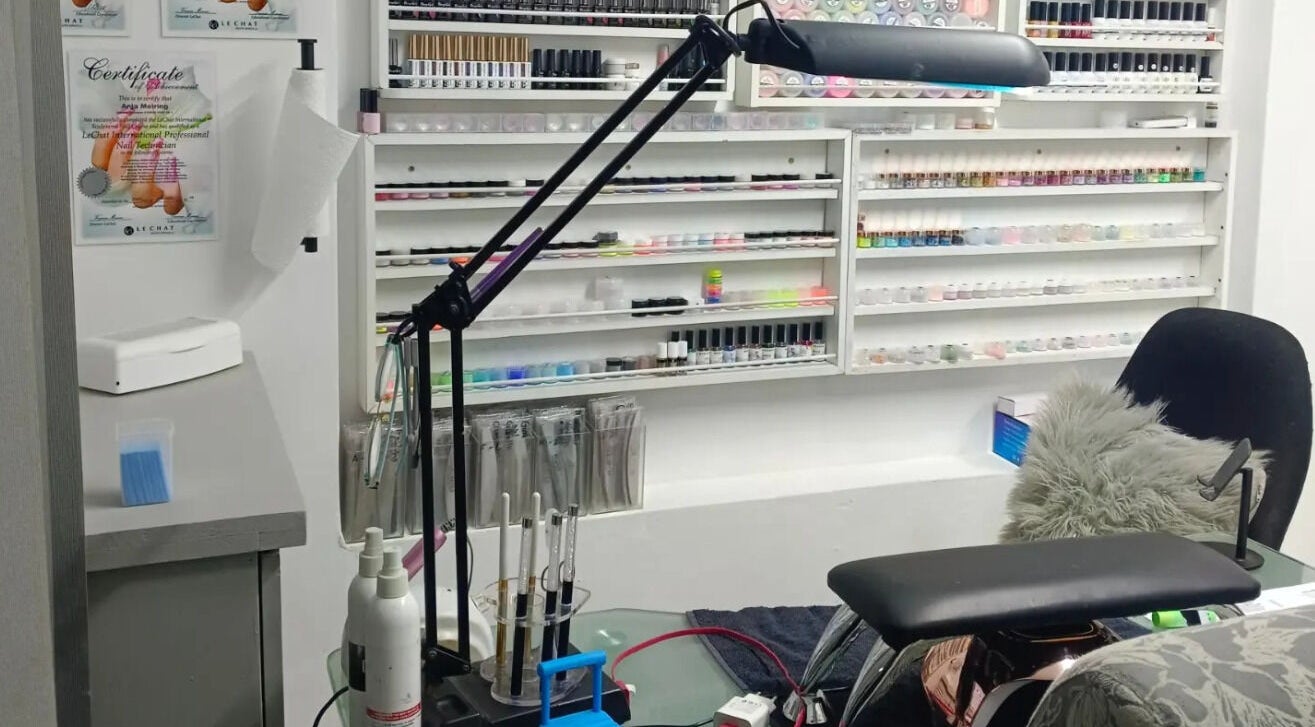 Nail studio at Dare 2B Beautiful, Boksburg, Gauteng, ZA, showcasing organized polishes and equipment.