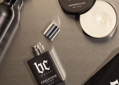 Barberista grooming products in Celbridge, County Kildare, IE, including clay and perfume on a sleek surface.