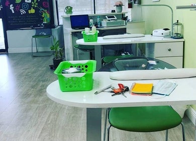 Modern interior of Liquid Glamour Nails Salon in Miami, Florida, US with stylish manicure stations.