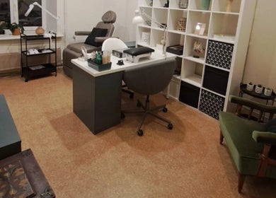 Cozy manicure station at Nails & Pearls Manikīra studija, Rīga, LV, featuring a chair and work desk.