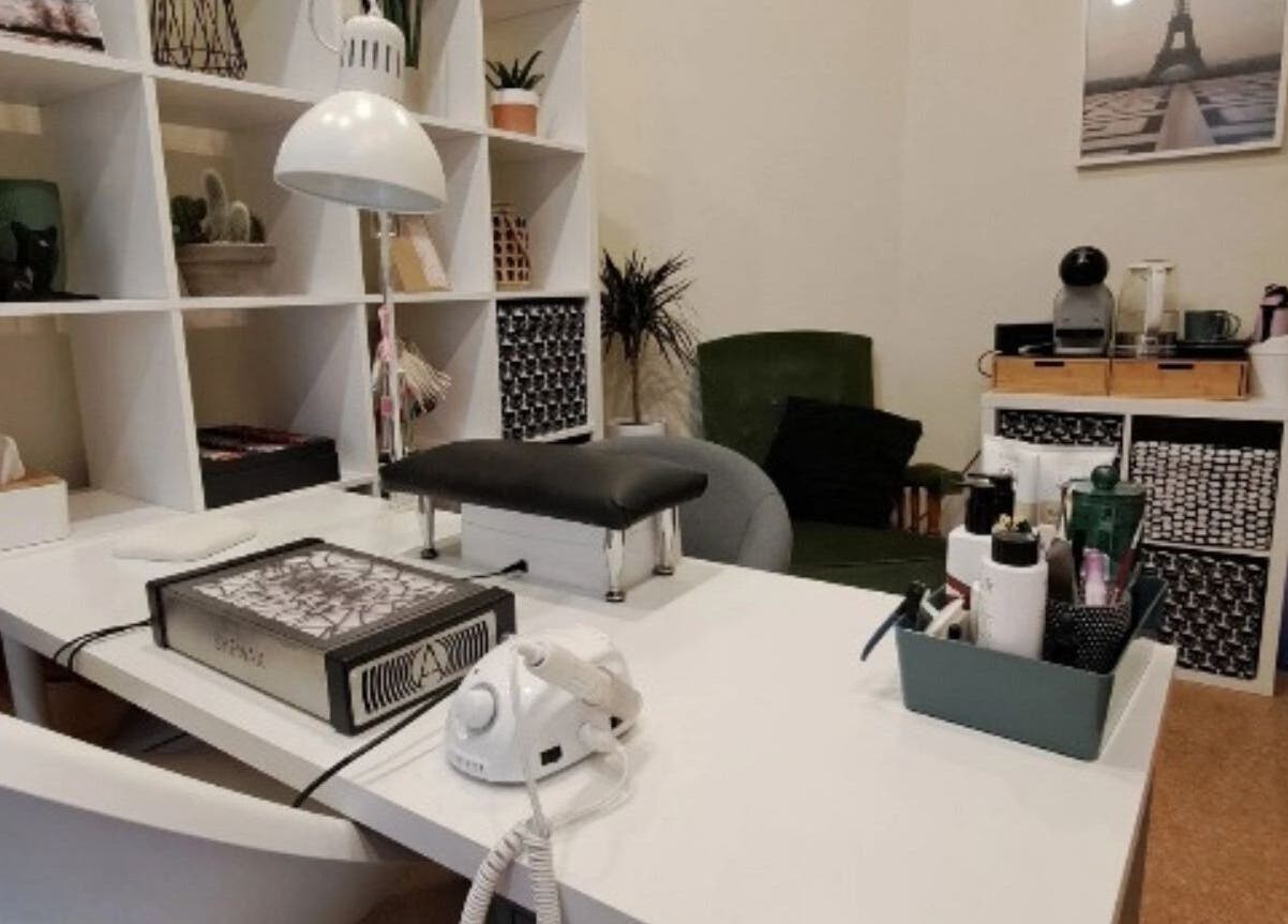 Modern nail station at Nails & Pearls Manikīra studija in Rīga, LV with nail tools and decor accents.