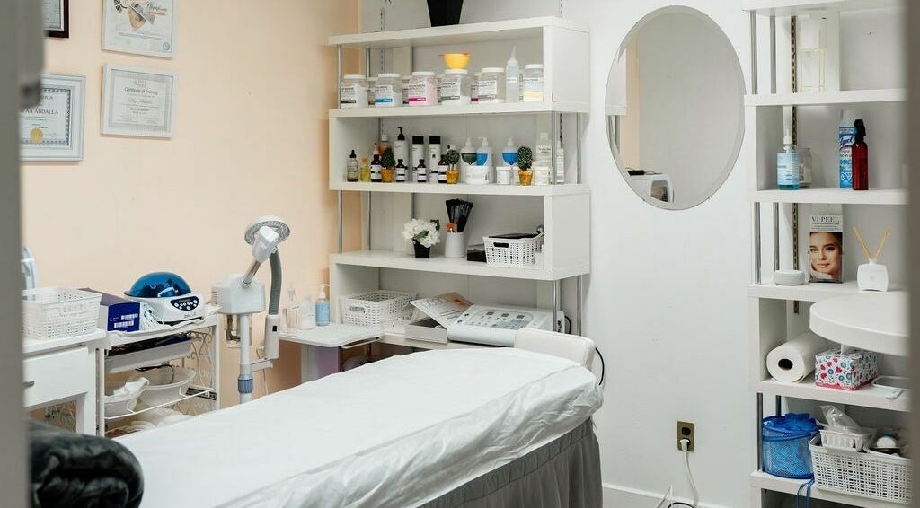 Tranquil treatment room at Beauty World Nyc Queens featuring a massage table and products, New York, New York, US.