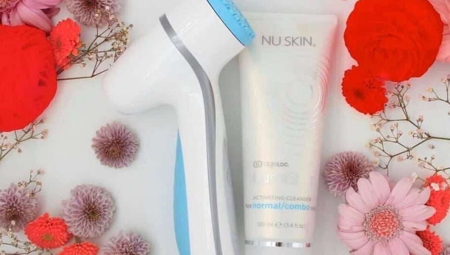 Beauty device and skincare product with flowers at Bronzed Beauty, Bournemouth, England, GB.